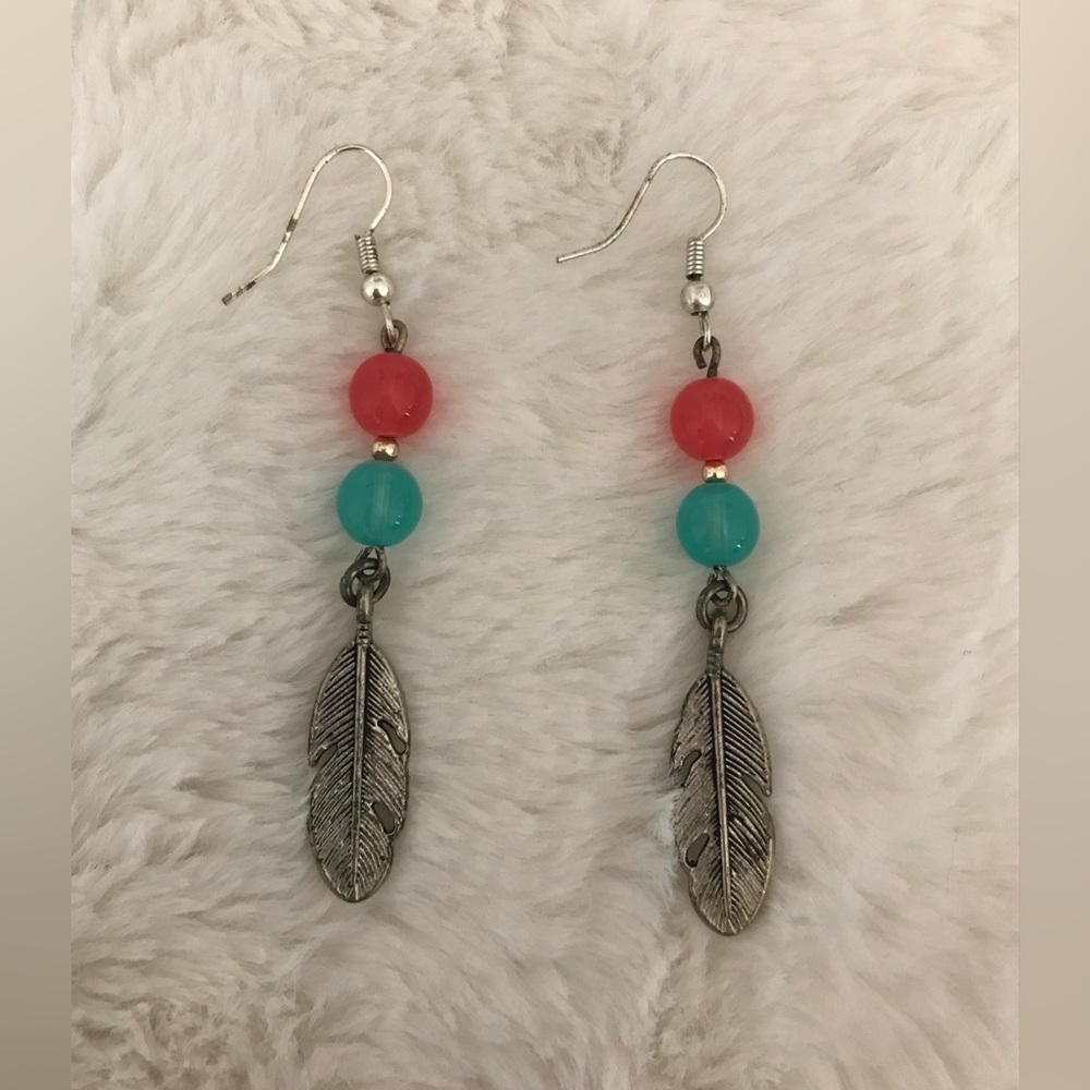 Earrings with feather
